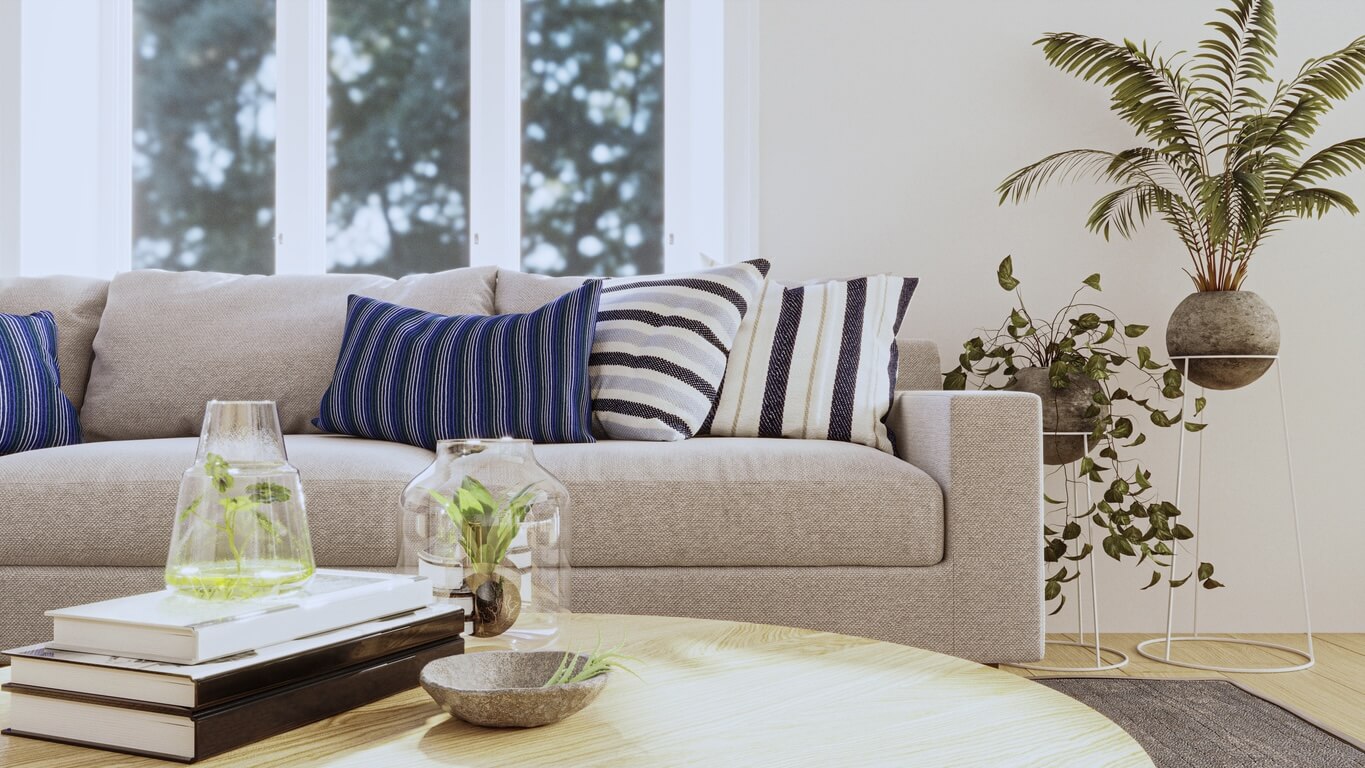 Therapy office with white couch and blue pillows