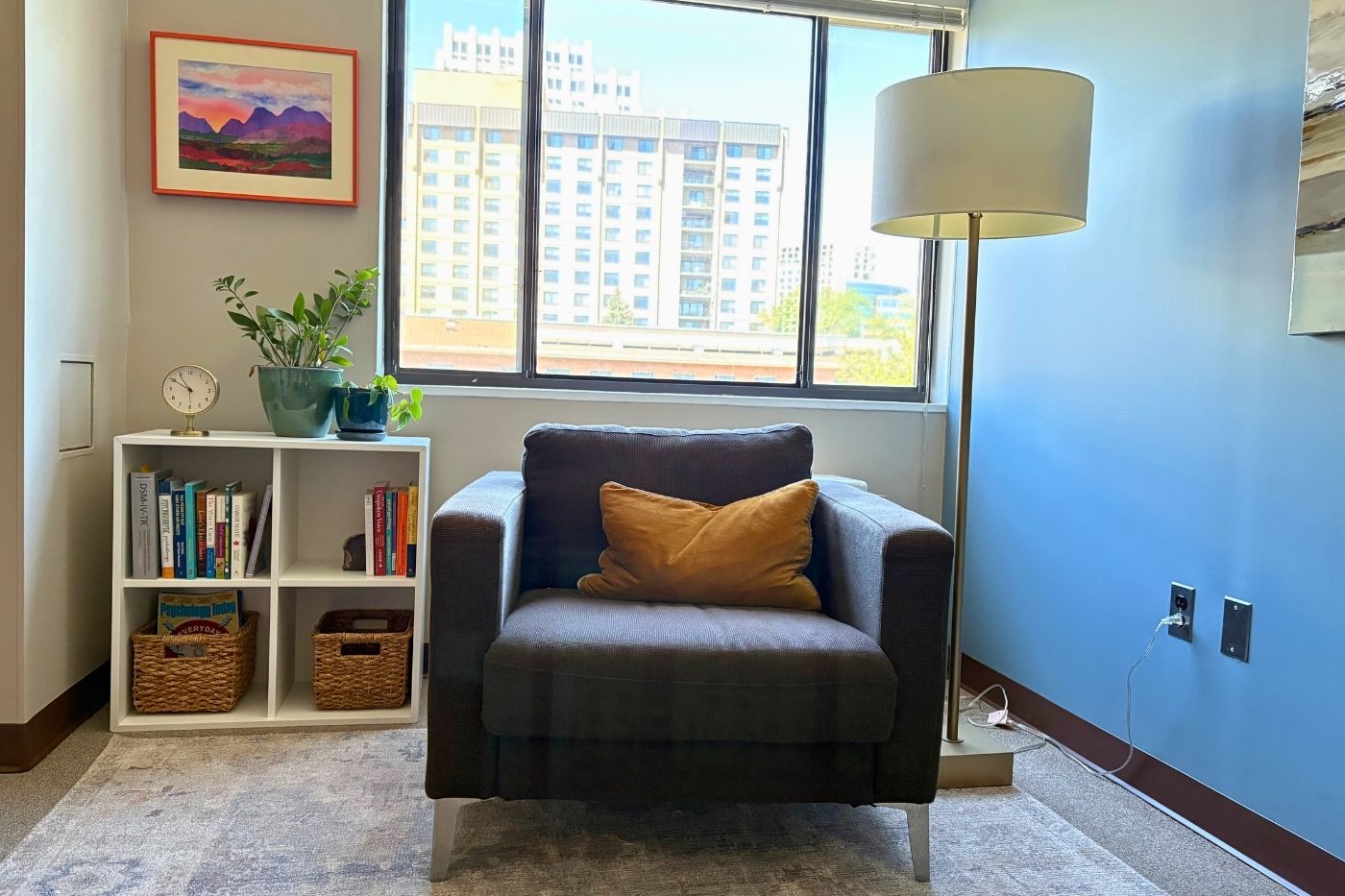 Therapy office with photo of mountains, bringing in personal artwork without disclosing too much.